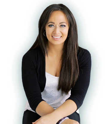 A Photo of Thais sitting with her arms crossed and smiling at the camera :)